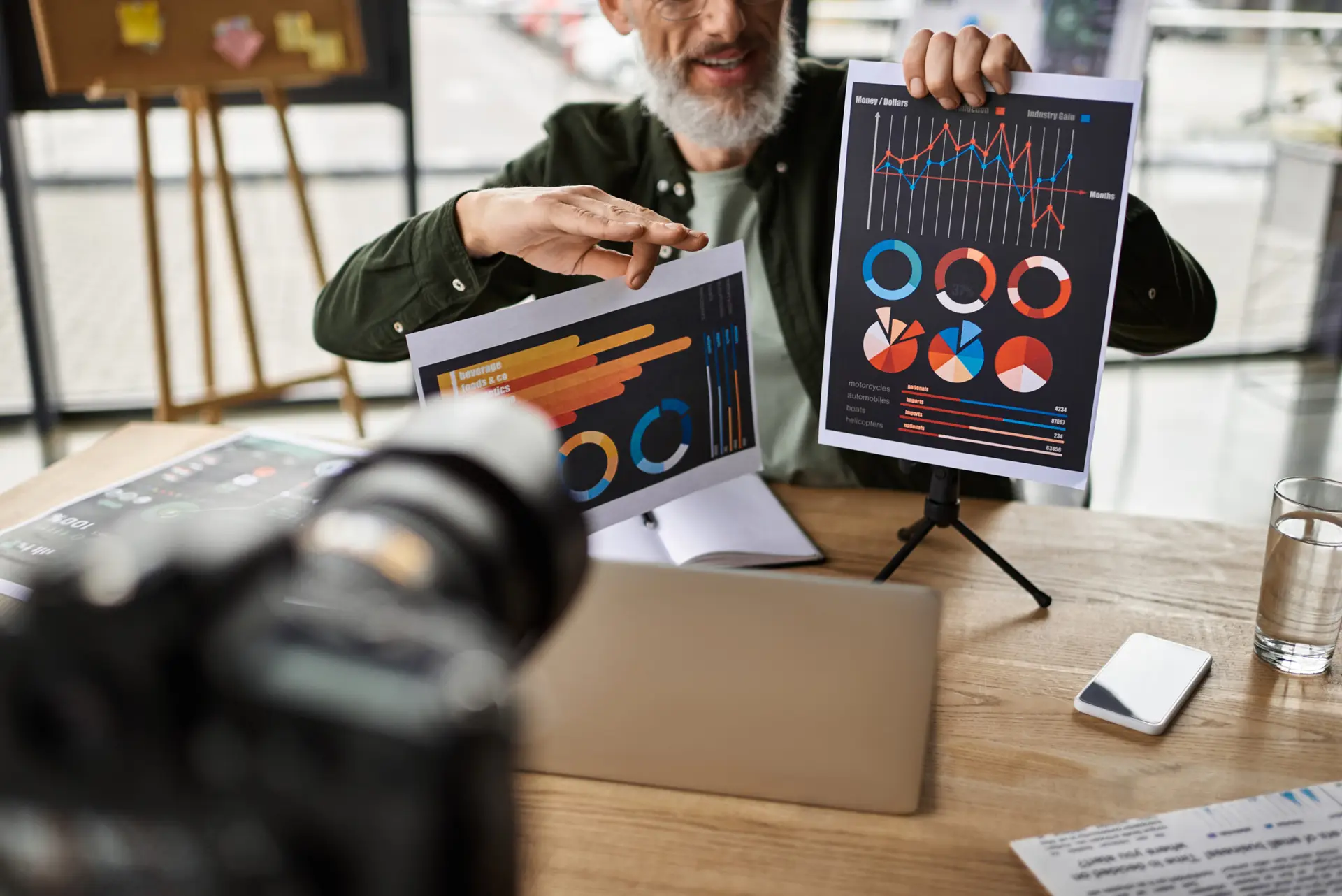 a professional shares insights with charts in a sleek office during a business meeting.